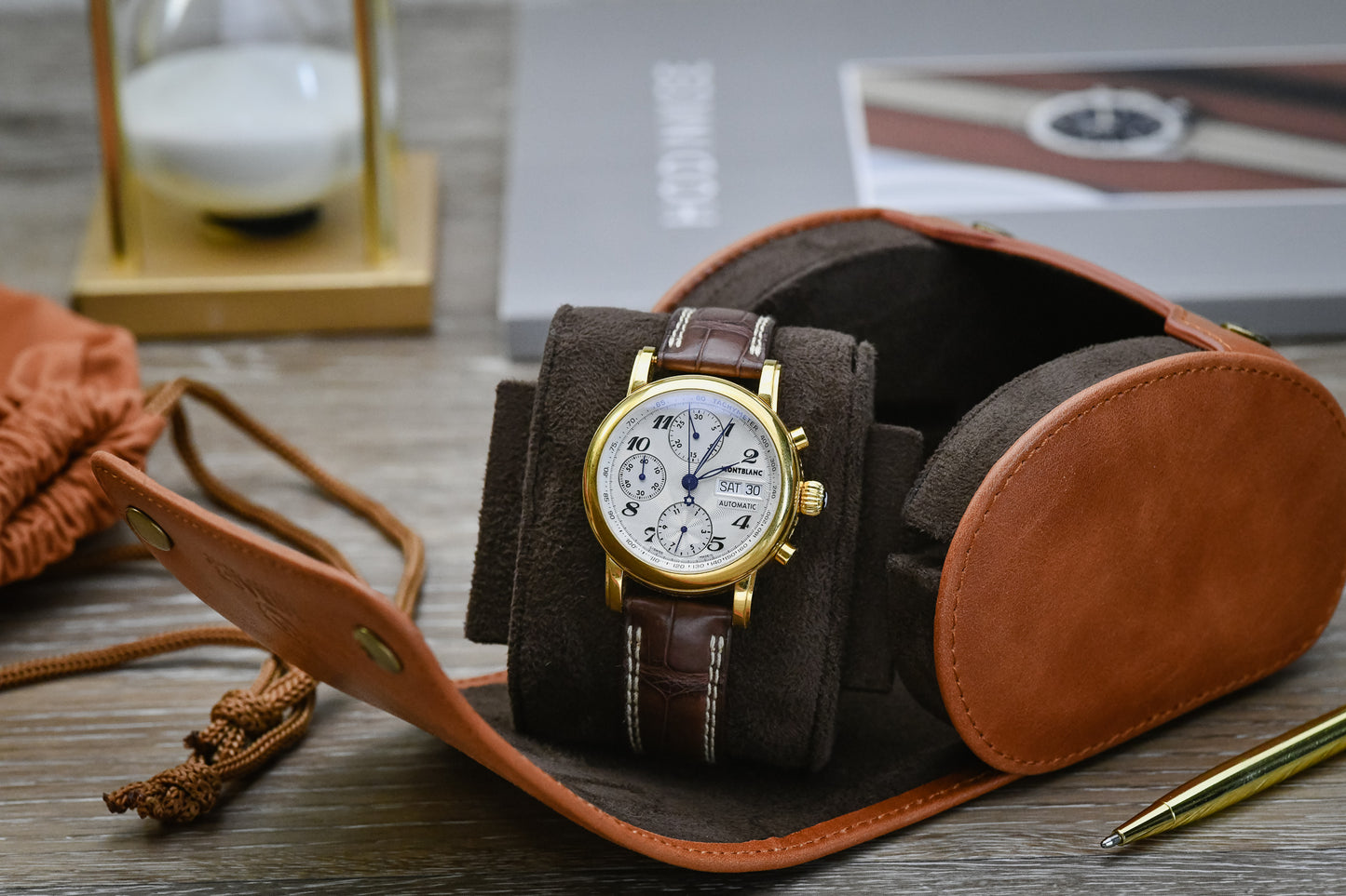 Tawny Brown full-grain cow leather 1 watch roll displayed with a luxury watch and travel accessories, showcasing elegant watch storage for collectors.
