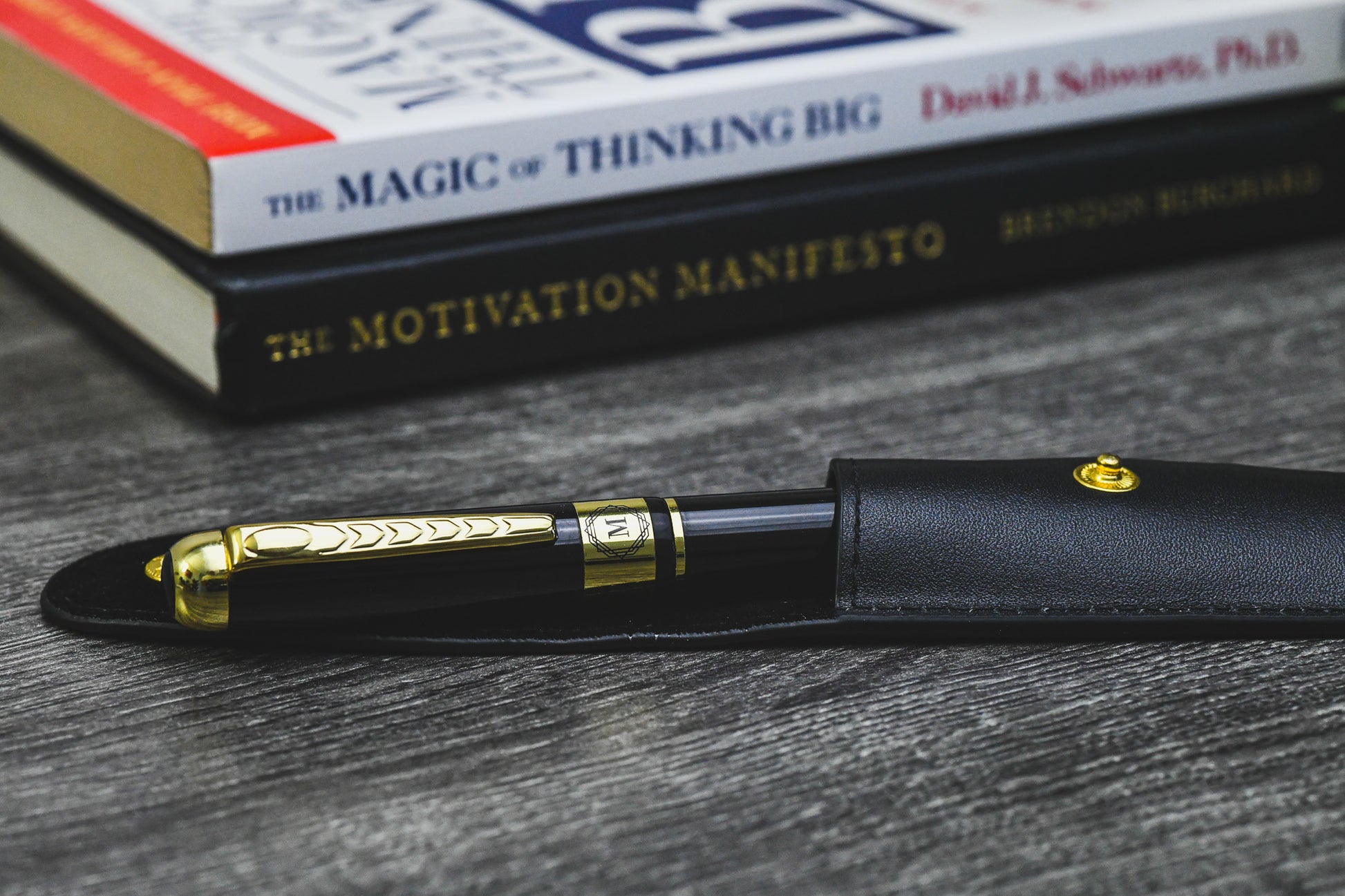 Mirage Luxury Travel Splendor Black executive pen displayed on books, highlighting premium craftsmanship and elegant writing for professionals.