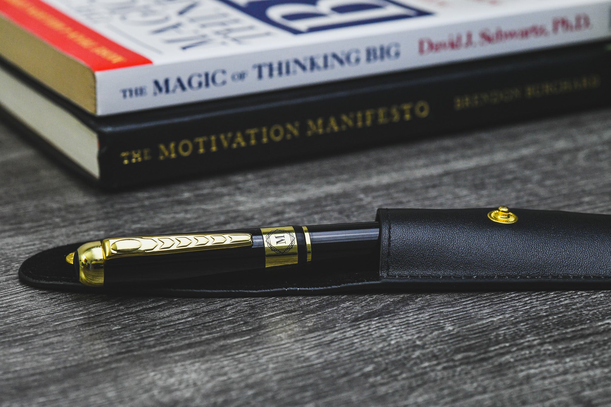 Mirage Luxury Travel Splendor Black executive pen displayed on books, highlighting premium craftsmanship and elegant writing for professionals.
