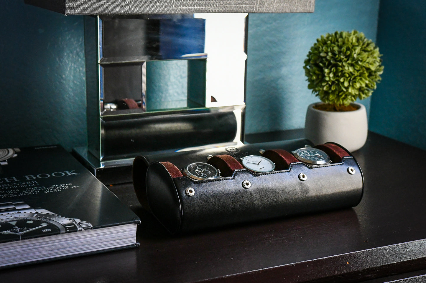 Jade Black vegan leather watch roll displayed on luxury desk with premium watch accessories