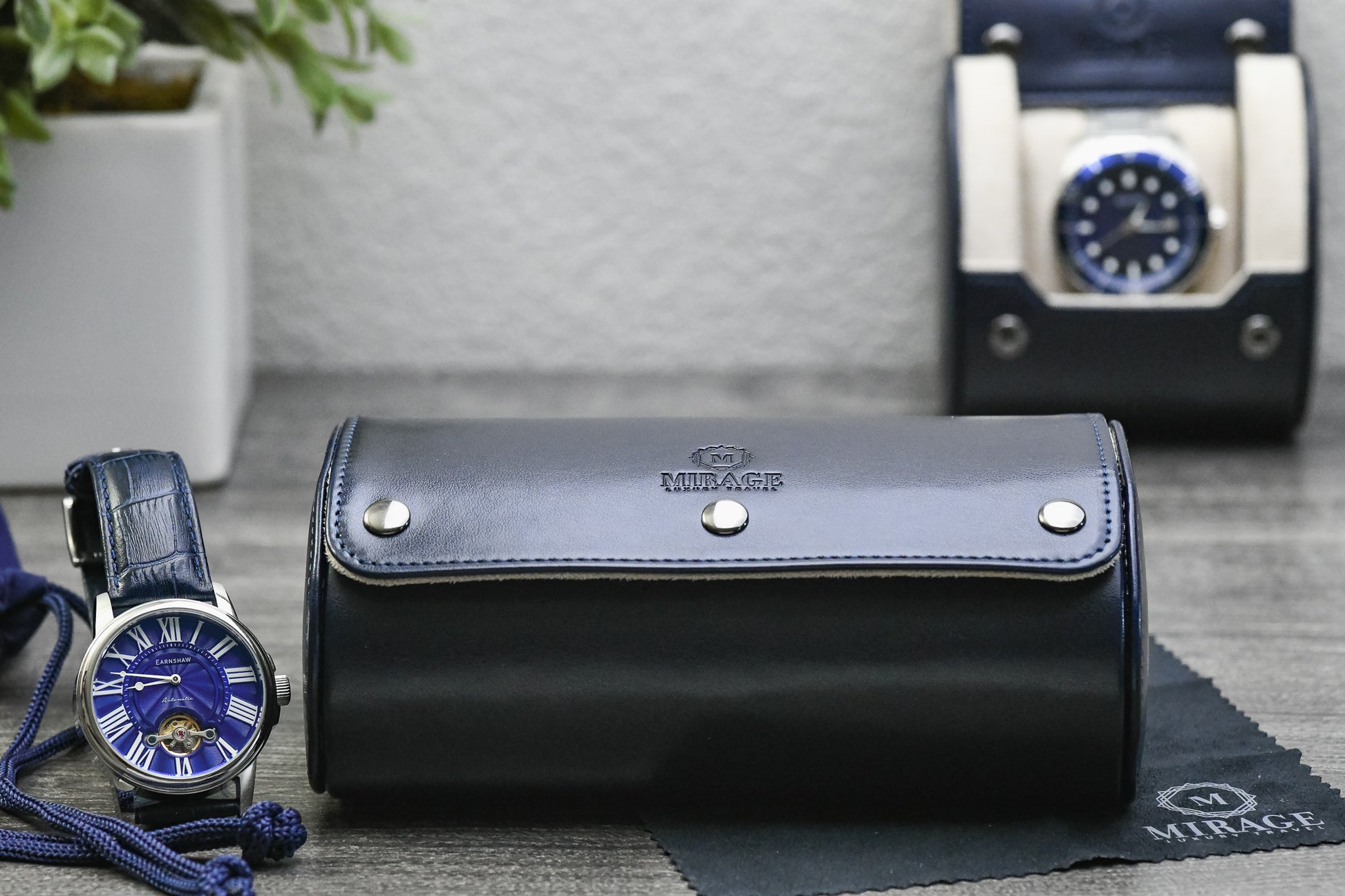 Closed Midnight Blue vegan leather 2 watch roll with ivory white interior designed for business travel and everyday watch protection.