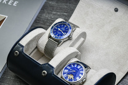 Close-up of luxury watch resting inside the Midnight Blue vegan leather 2 watch travel case with soft ivory white interior.