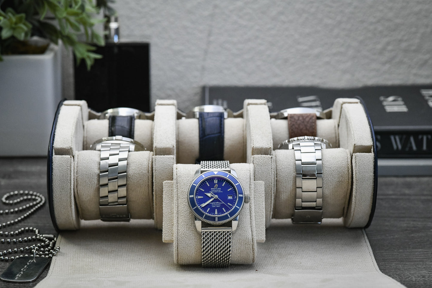 Luxury watches organized inside Midnight Blue 6 watch roll featuring soft ivory white suede lining for superior protection