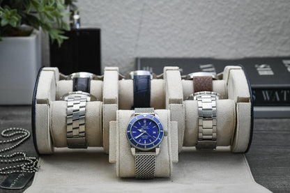 Luxury watches organized inside Midnight Blue 6 watch roll featuring soft ivory white suede lining for superior protection