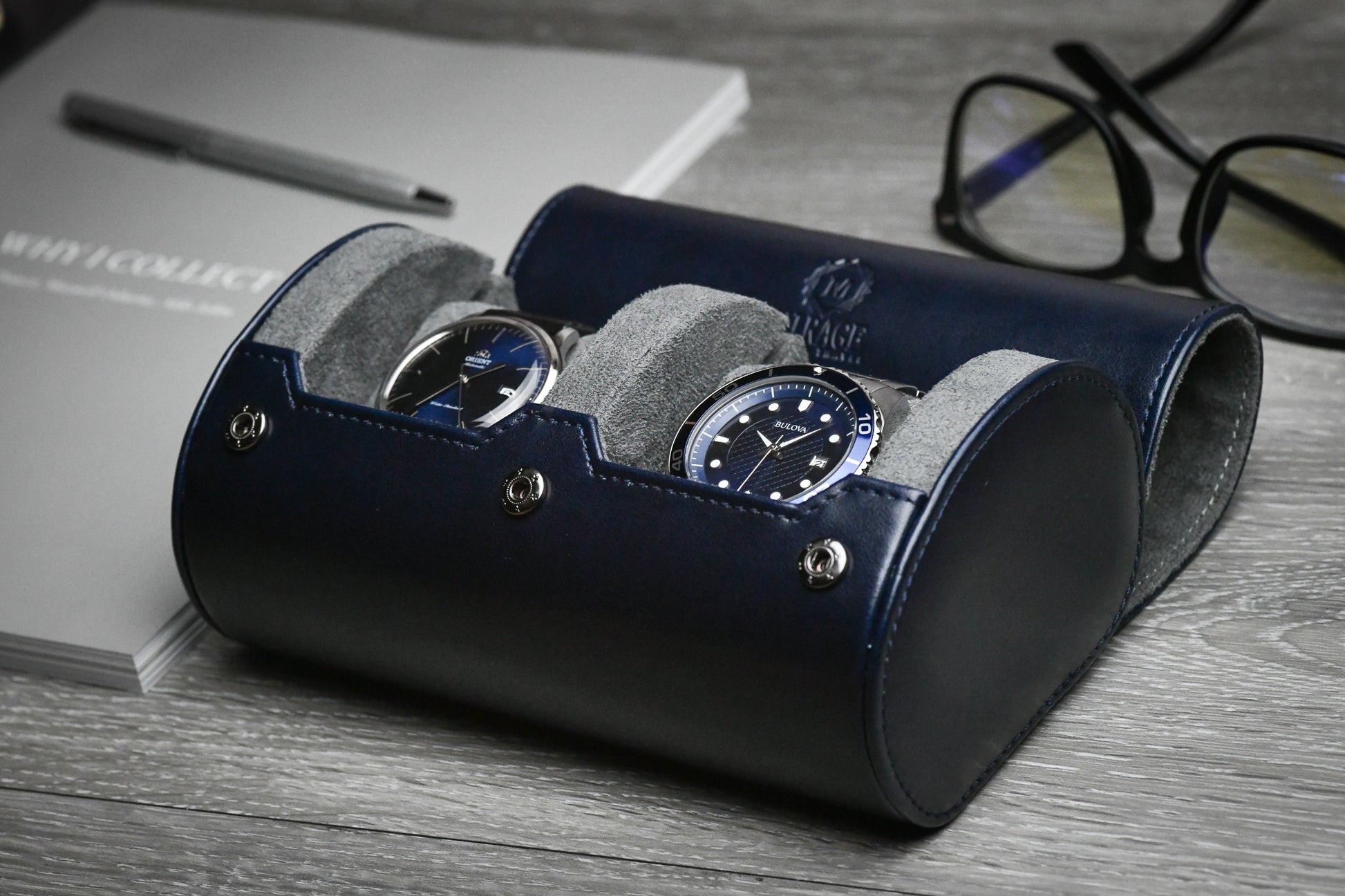 Midnight Blue vegan leather 2 watch roll displayed with luxury watches on a premium workspace.