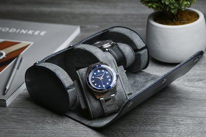 Luxury watches displayed inside the Midnight Blue vegan leather 2 watch travel case with soft suede interior.