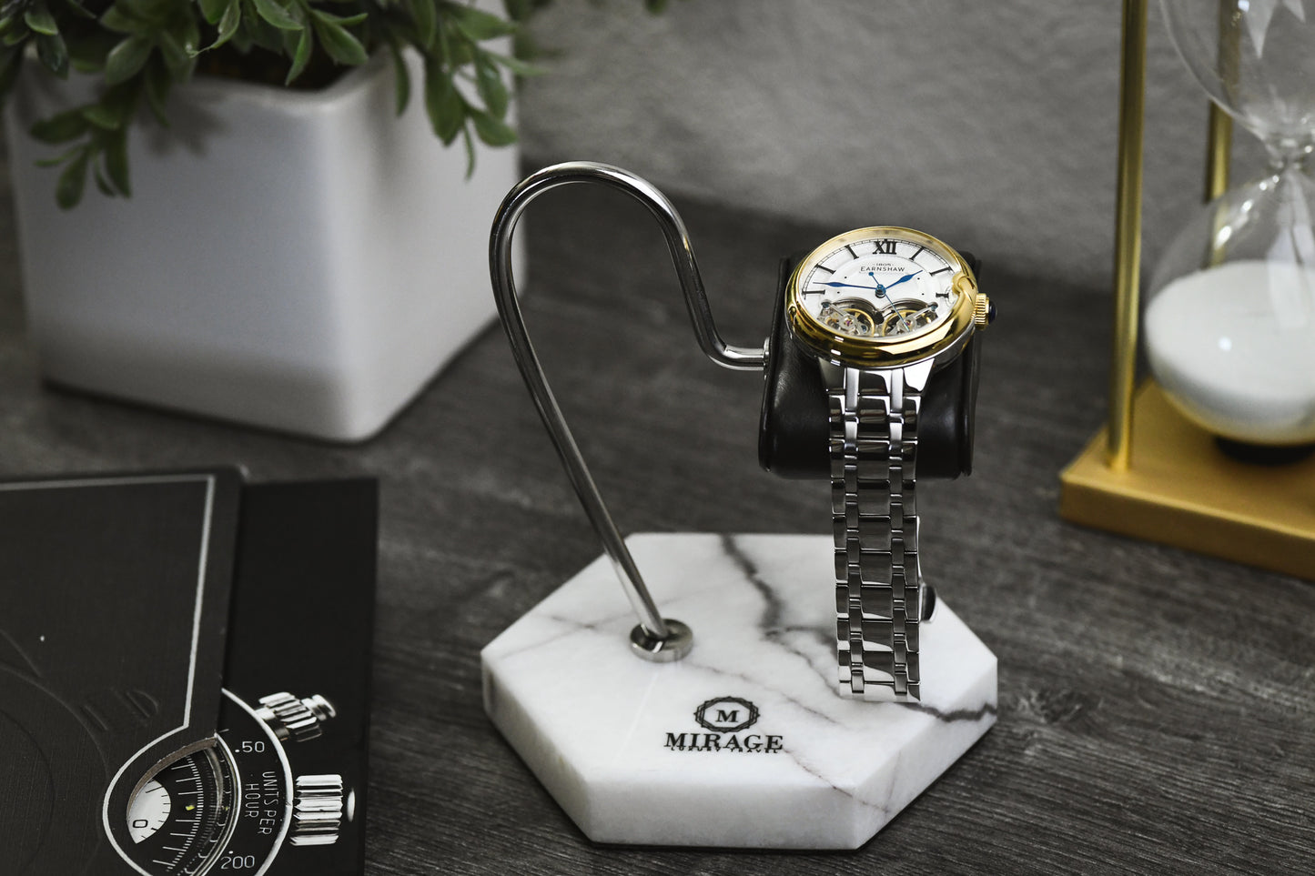 Mirage Luxury Travel Elite White Lilac Marble watch stand displayed on a desk with a luxury watch, offering elegant protection and sophisticated presentation.