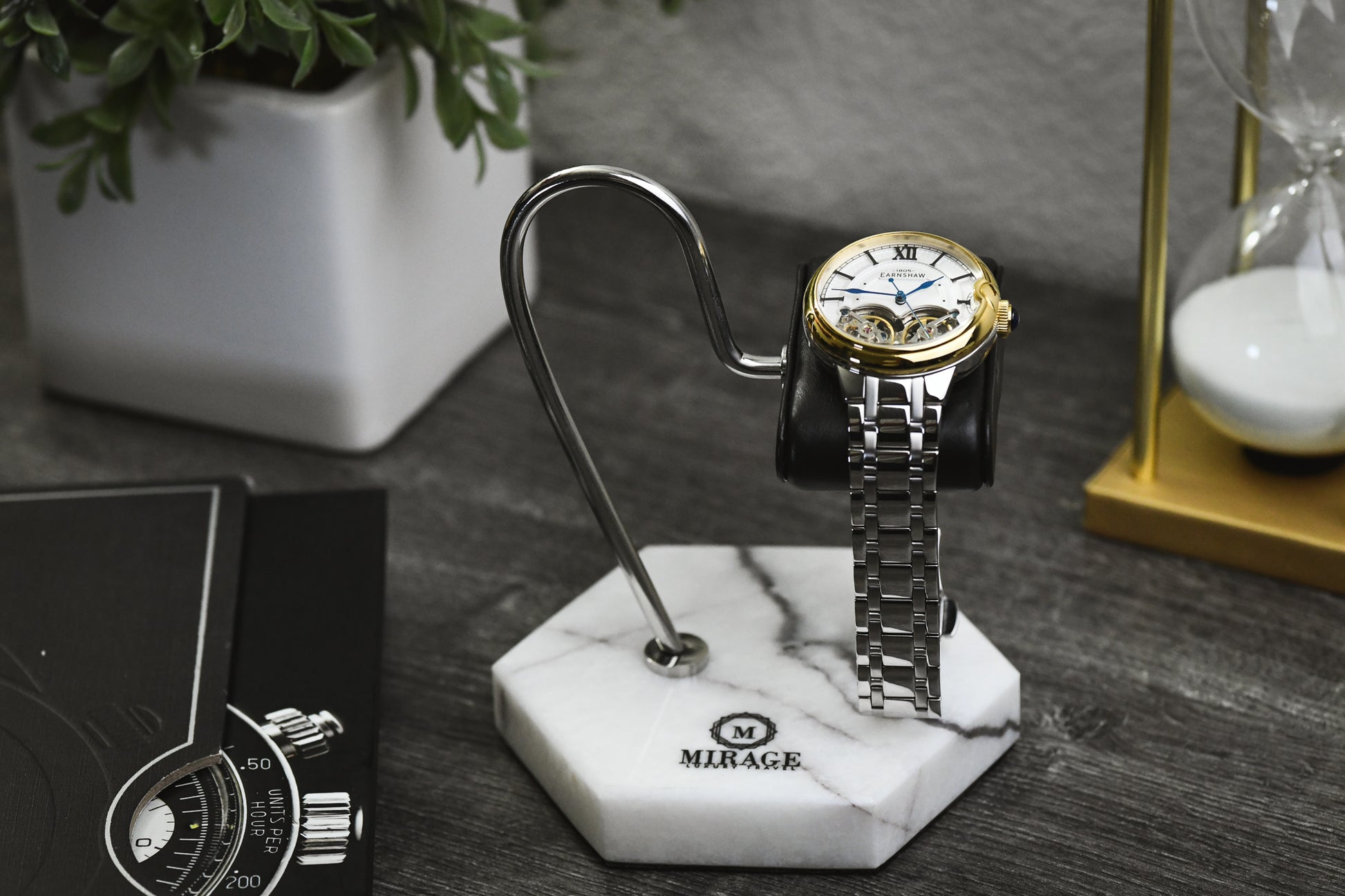 Mirage Luxury Travel Elite White Lilac Marble watch stand displayed on a desk with a luxury watch, offering elegant protection and sophisticated presentation.
