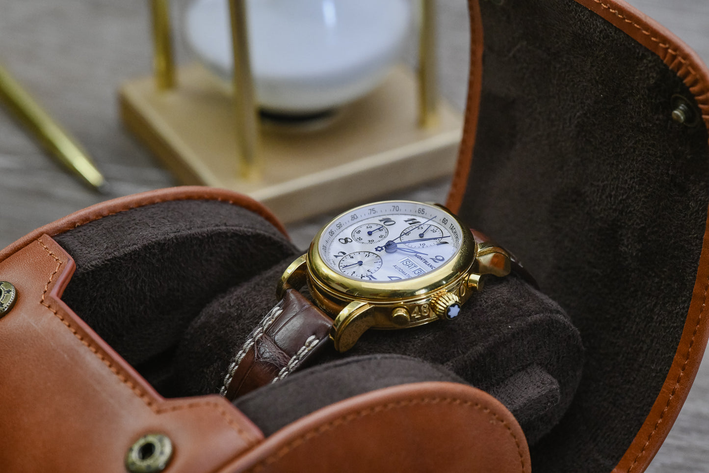 Close-up of the Tawny Brown full-grain cow leather 1 watch travel case with a luxury watch, highlighting the plush suede interior and premium craftsmanship.