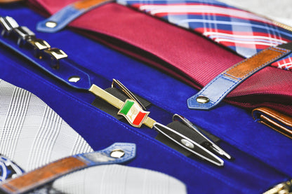 Close-up of dedicated compartments for ties, tie clips, cufflinks, and collar stays inside the Royal Blue vegan leather tie travel case.