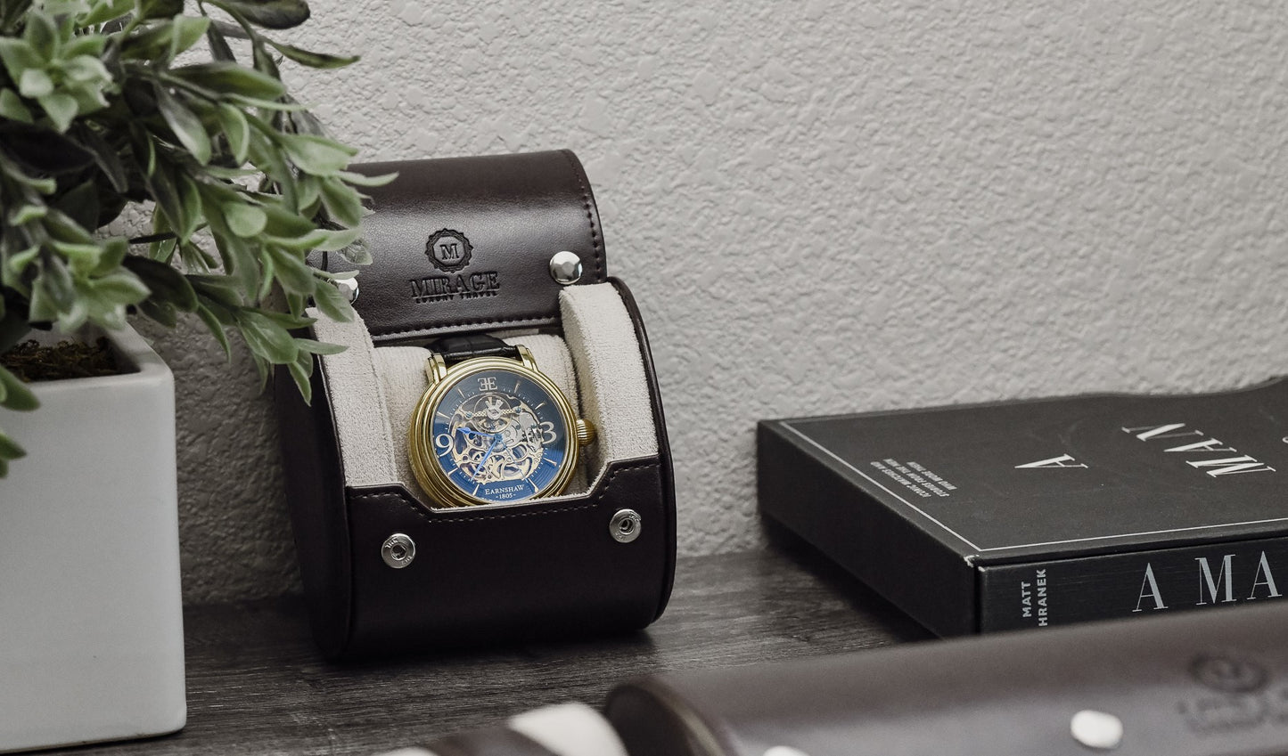Mirage Luxury Travel Signature Collection Espresso Brown luxury watch roll with an Ivory White premium suede-lined interior displayed in a modern office setting for everyday watch storage.