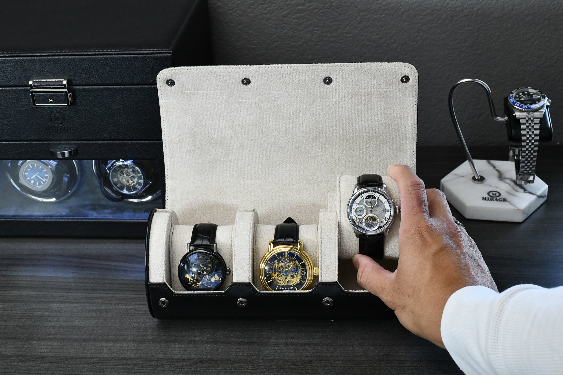 Jade Black premium vegan leather watch roll displayed with luxury accessories and collector workspace