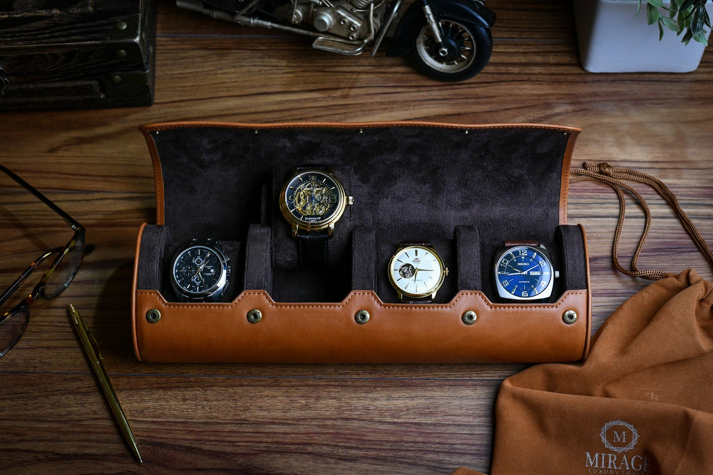 Luxury watch organizer displaying four watches inside a premium leather travel case.
