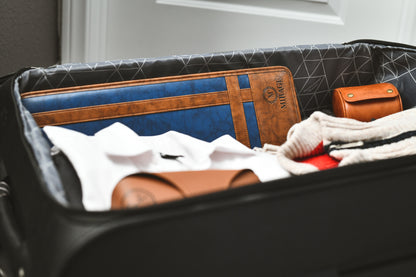 Royal Blue premium vegan leather tie travel case packed inside a suitcase, showcasing compact organization for formal accessories while traveling.