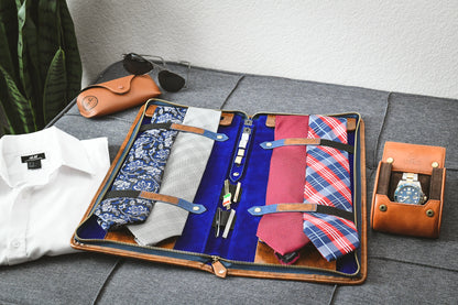 Open Royal Blue premium vegan leather tie travel case with organized ties, cufflinks, tie clips, and collar stays for business travel.