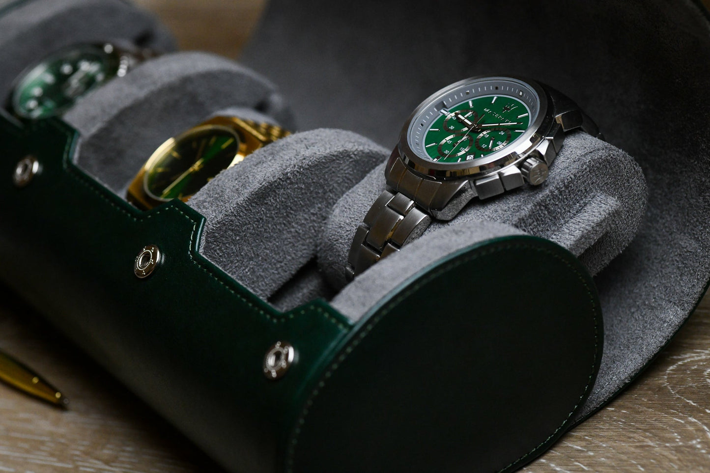 Luxury watches securely stored inside Royal Green 3 watch organizer with soft gray suede watch cushions