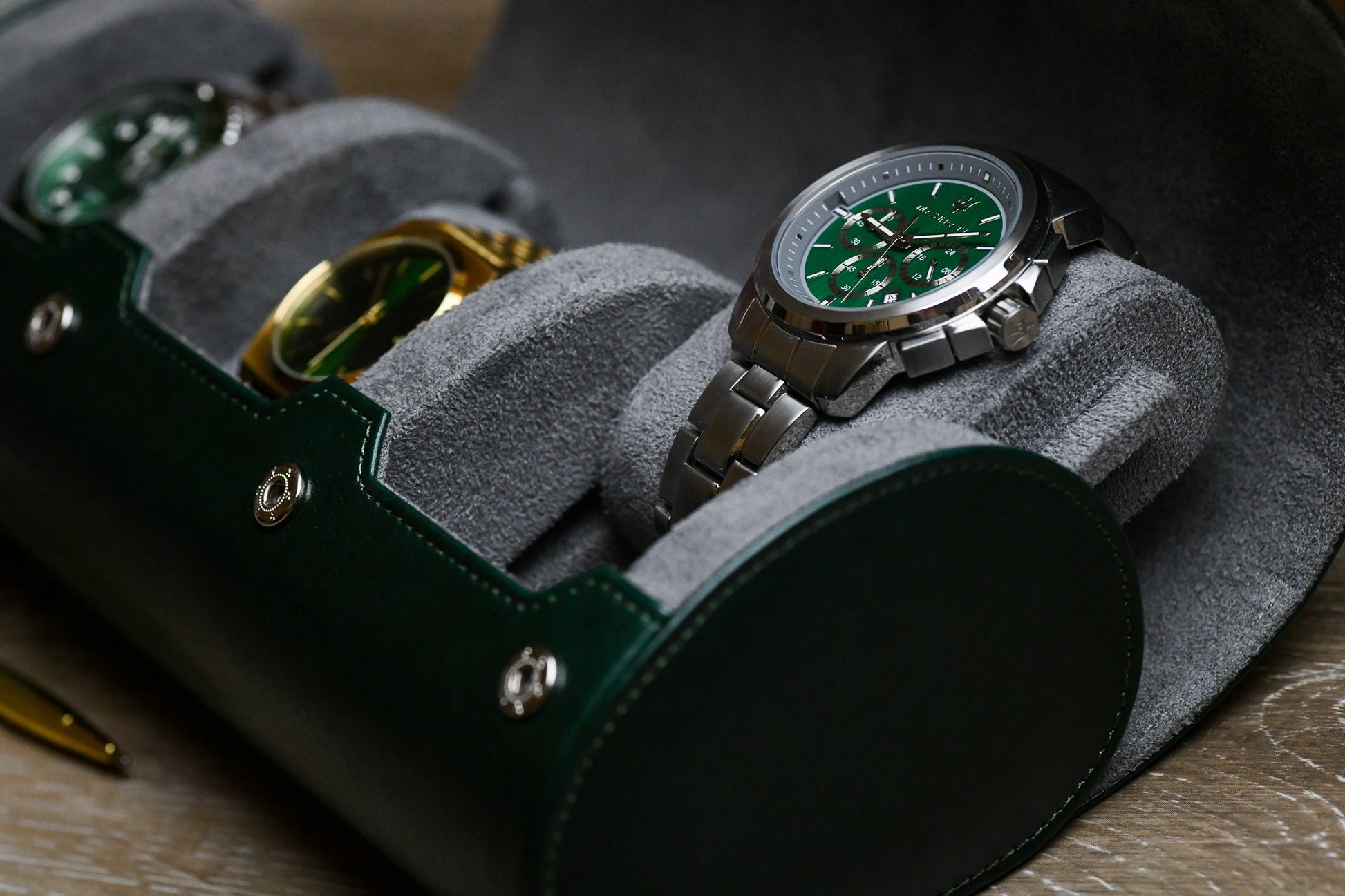 Luxury watches securely stored inside Royal Green 3 watch organizer with soft gray suede watch cushions