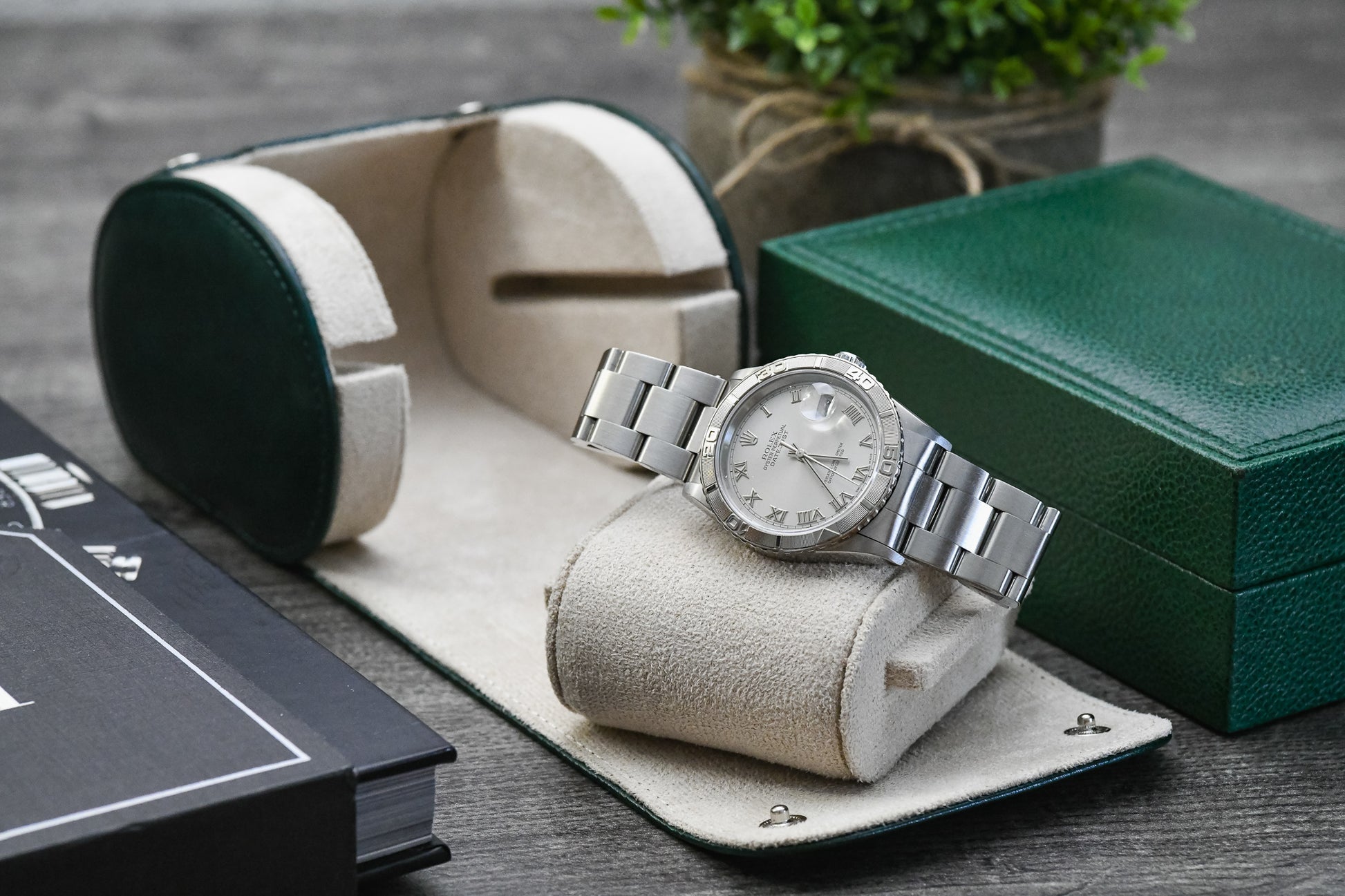 Luxury watch displayed inside the Royal Green vegan leather watch roll with plush ivory white suede lining.