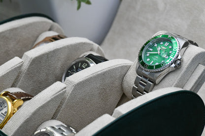 Close-up of luxury watches protected inside Royal Green vegan leather 6 watch roll with soft ivory white suede interior