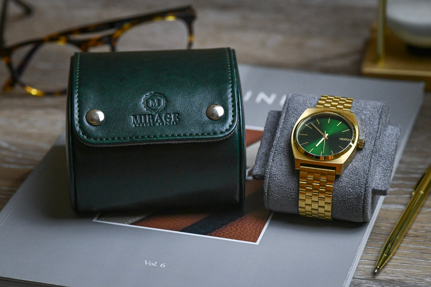 Royal Green vegan leather watch roll displayed with a luxury timepiece and Mirage Luxury Travel packaging.
