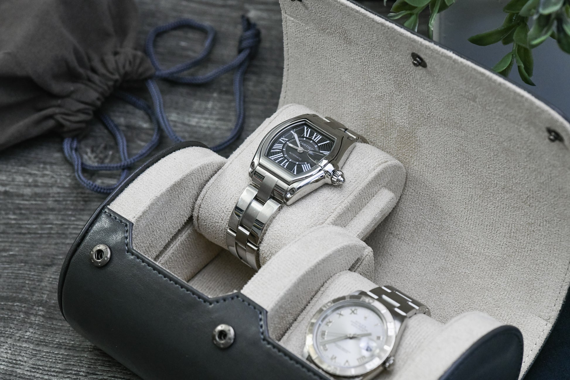 Luxury watches displayed inside the Slate Gray vegan leather 2 watch travel case with ivory white suede interior.