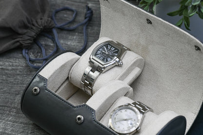 Luxury watches displayed inside the Slate Gray vegan leather 2 watch travel case with ivory white suede interior.