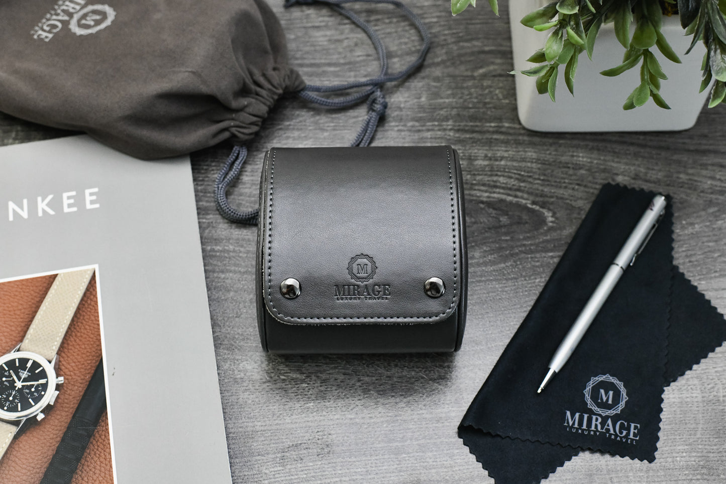 Slate Gray vegan leather watch roll displayed with Mirage Luxury Travel gift-ready packaging.
