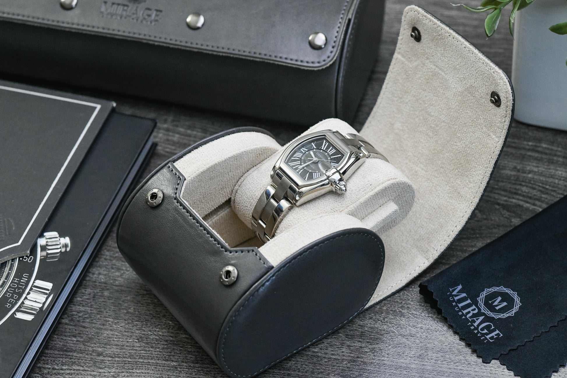 Luxury watch displayed inside the Slate Gray vegan leather watch roll with plush ivory white suede lining.
