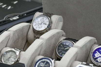Close-up of luxury watch protected inside Slate Gray premium vegan leather watch roll with ivory white suede lining