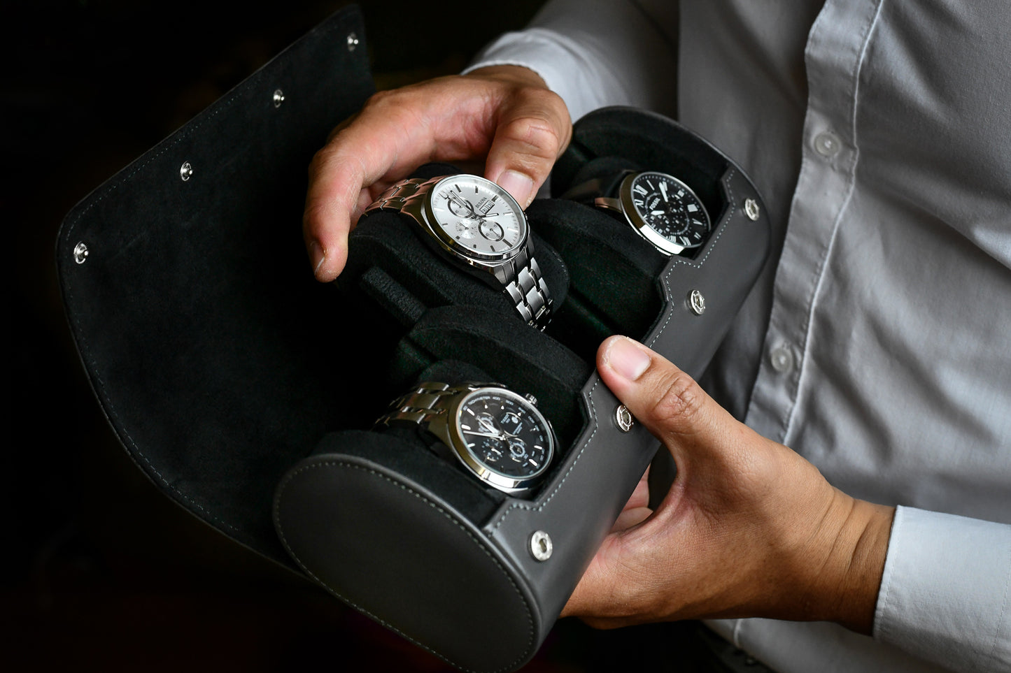 Close-up of luxury watches secured inside Slate Gray 3 watch travel case with premium suede watch cushions