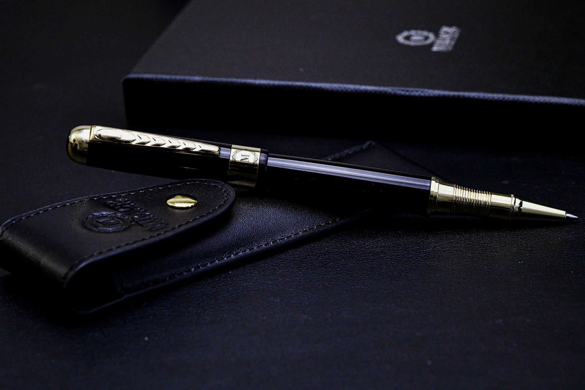 Mirage Luxury Travel Splendor Black luxury executive pen with genuine leather pen pouch, featuring a premium black stainless steel body and elegant gold-tone accents.