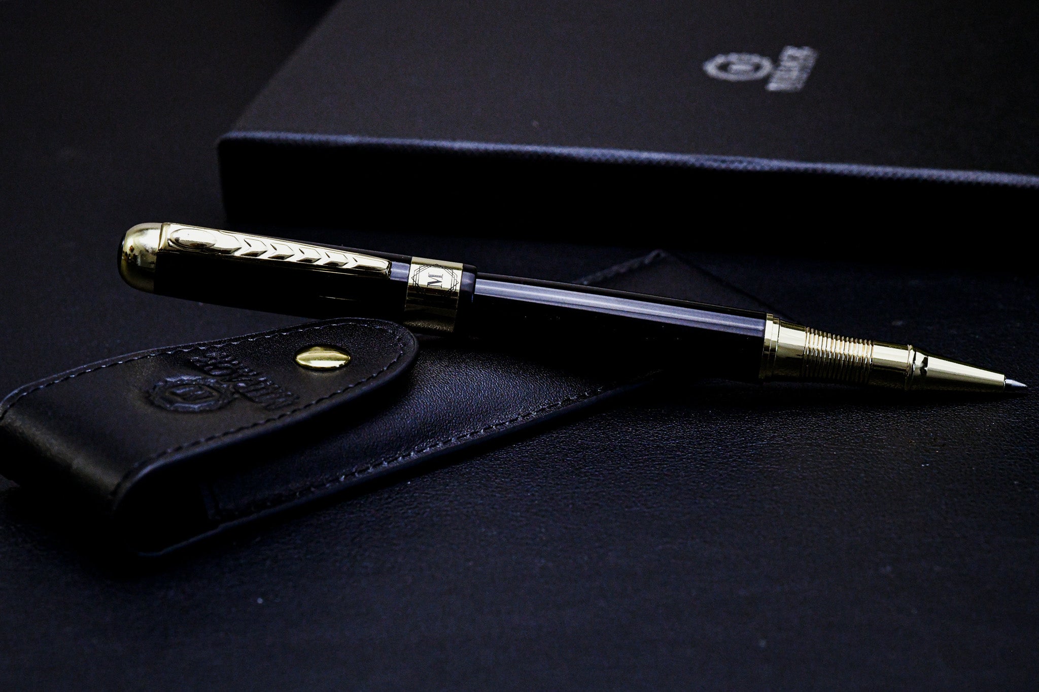 Mirage Luxury Travel Splendor Black luxury executive pen with genuine leather pen pouch, featuring a premium black stainless steel body and elegant gold-tone accents.