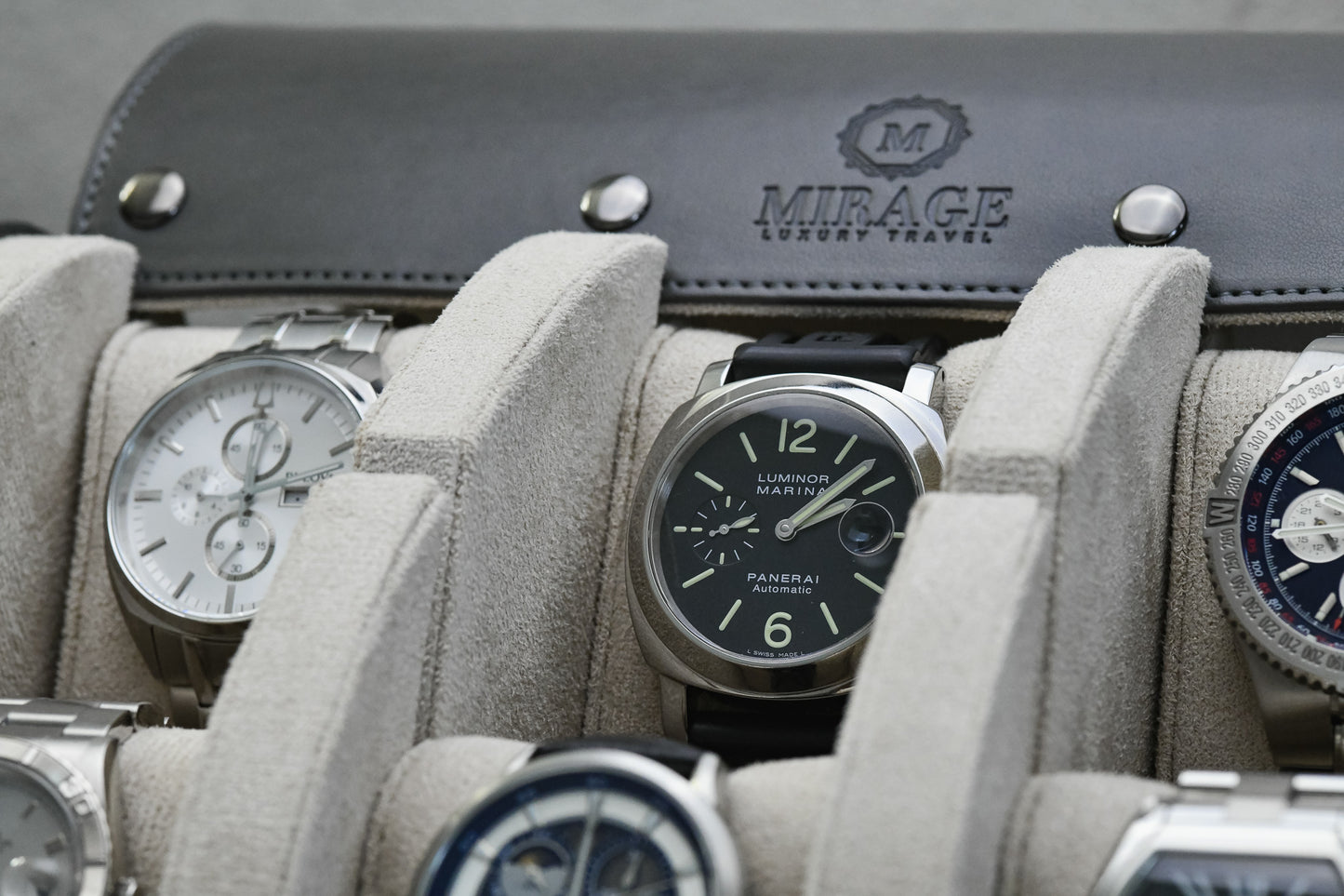 Close-up of the Super Black premium vegan leather 6 watch roll featuring plush suede watch cushions protecting Rolex, Panerai, Breitling, Omega and other luxury watches for travel and storage