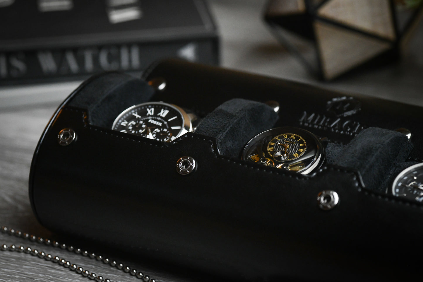 Three luxury watches protected inside the Super Black premium vegan leather watch travel organizer
