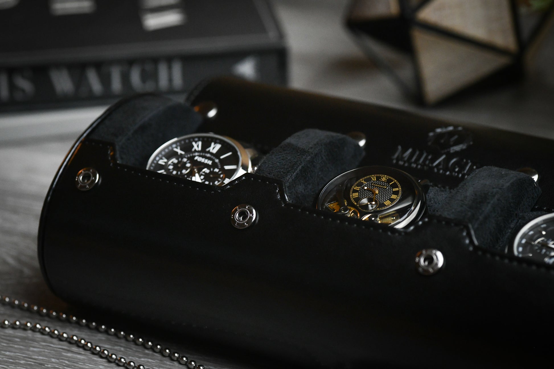 Three luxury watches protected inside the Super Black premium vegan leather watch travel organizer