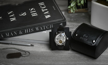 Super Black vegan leather watch roll displayed with Mirage Luxury Travel gift-ready packaging.