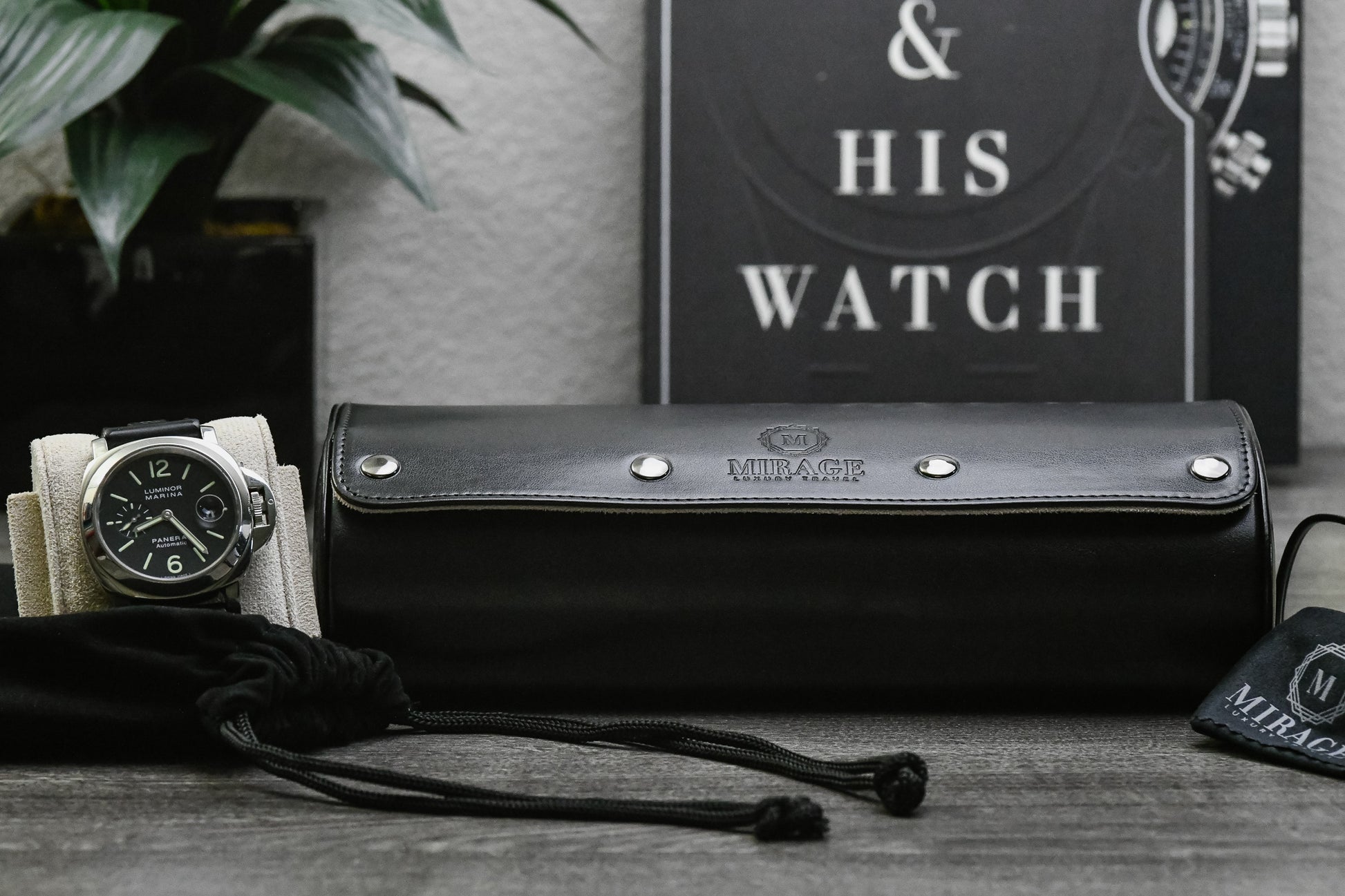 Close-up of luxury watch secured inside Jade Black 3 watch roll with sliding cushions and ivory white suede lining