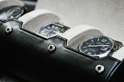 Close-up of luxury watch secured inside Jade Black 3 watch roll with sliding cushions and ivory white suede lining
