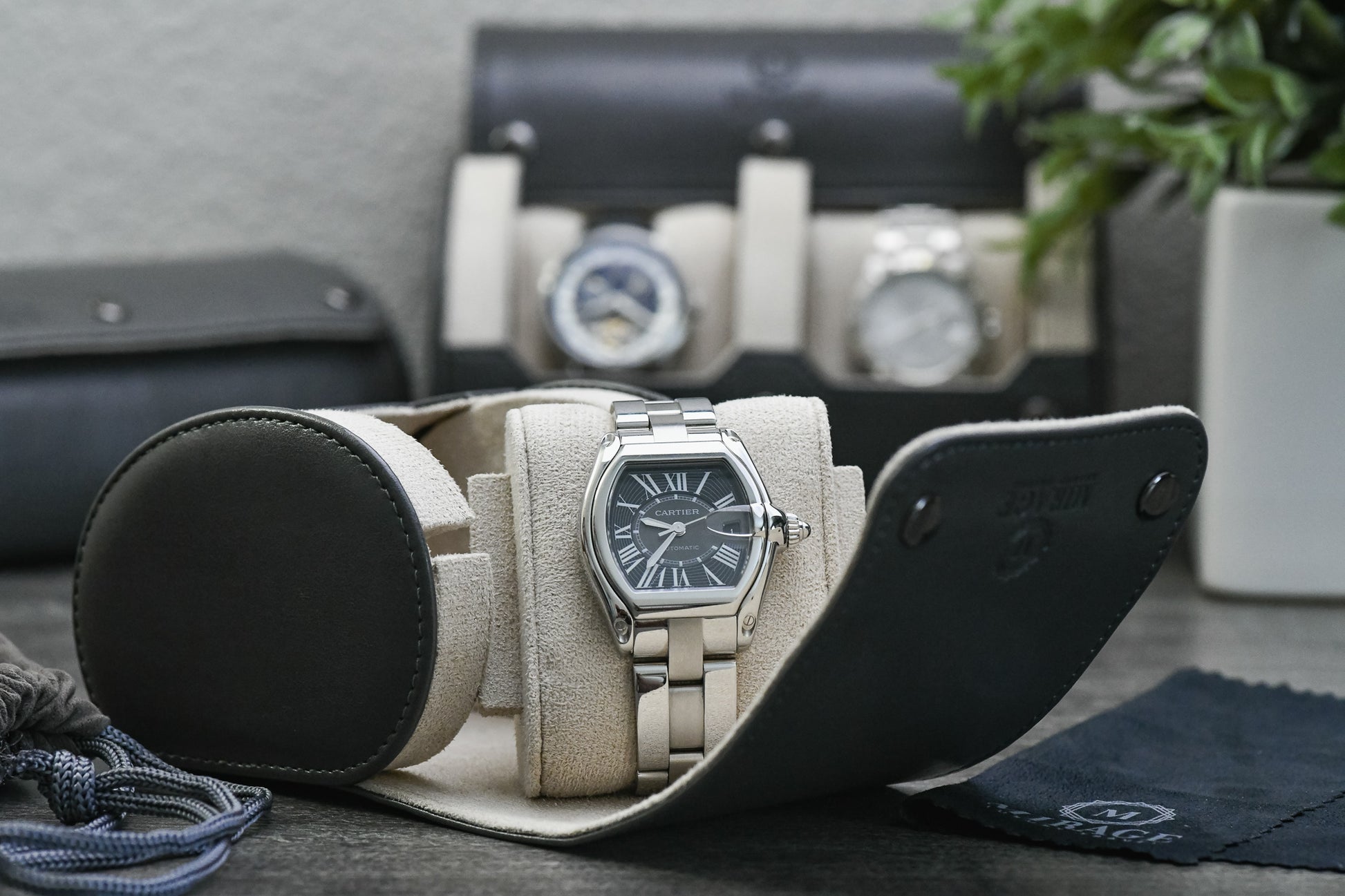 Premium unboxing experience of the Slate Gray vegan leather 1 watch roll by Mirage Luxury Travel.