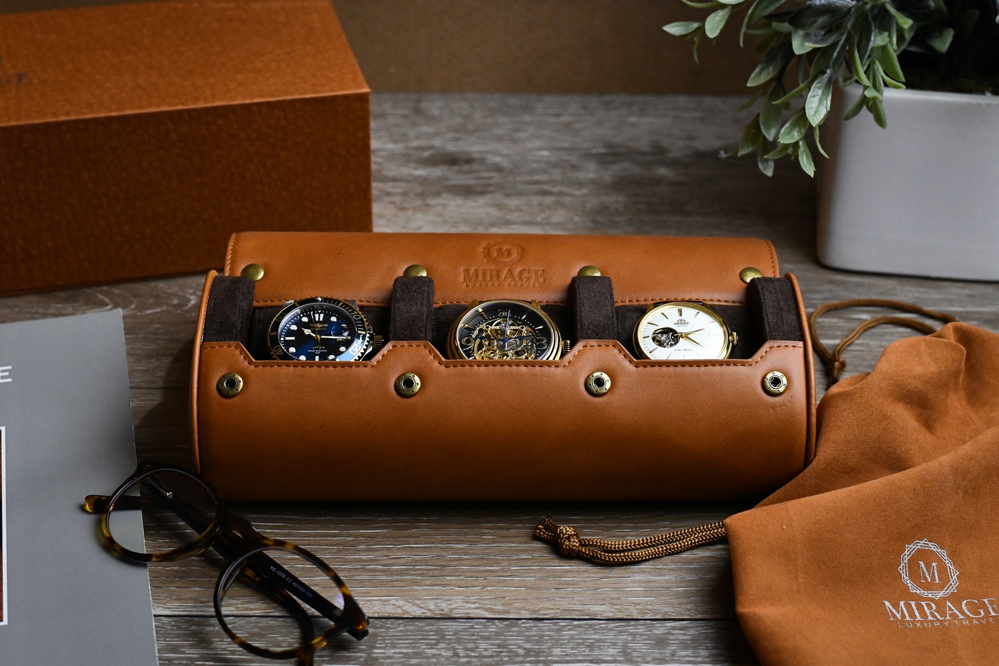 Tawny Brown full-grain leather 3 watch roll displaying luxury watches with premium travel accessories.
